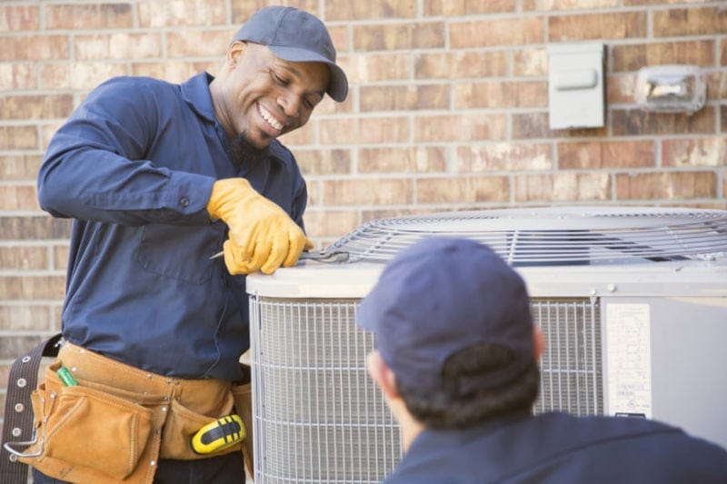 AC Technician Working on AC