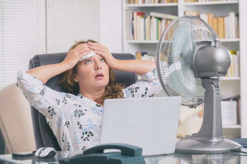 Woman Suffering from Heat in Home