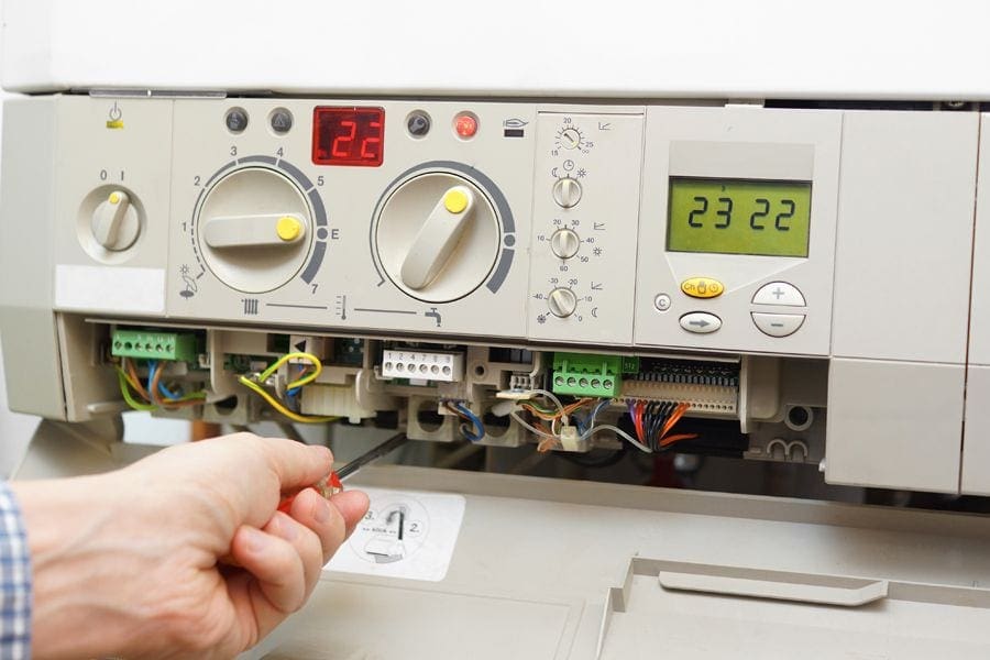 A furnace control panel. When Should You Replace Your Furnace?